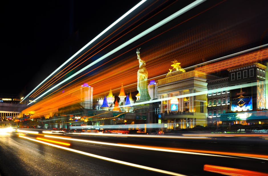 Colorful light trails and iconic landmarks on the Las Vegas Strip at night