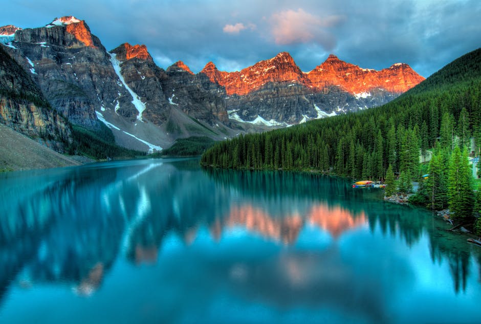 Capture the serene beauty of Moraine Lake with sunrise reflections in Banff National Park